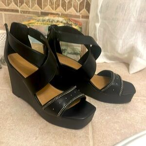 3+ inch black wedge zip back slip ins w criss cross straps front stud detail
